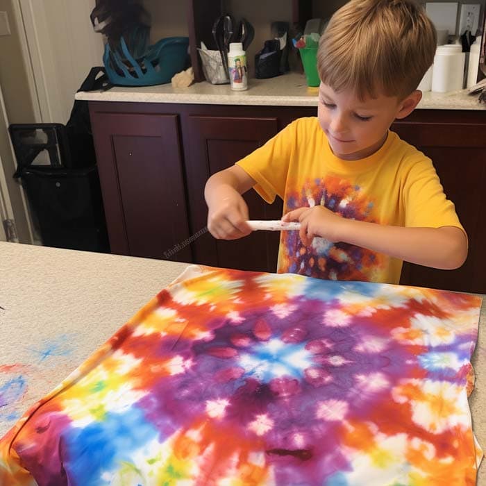 Child painting tie dye